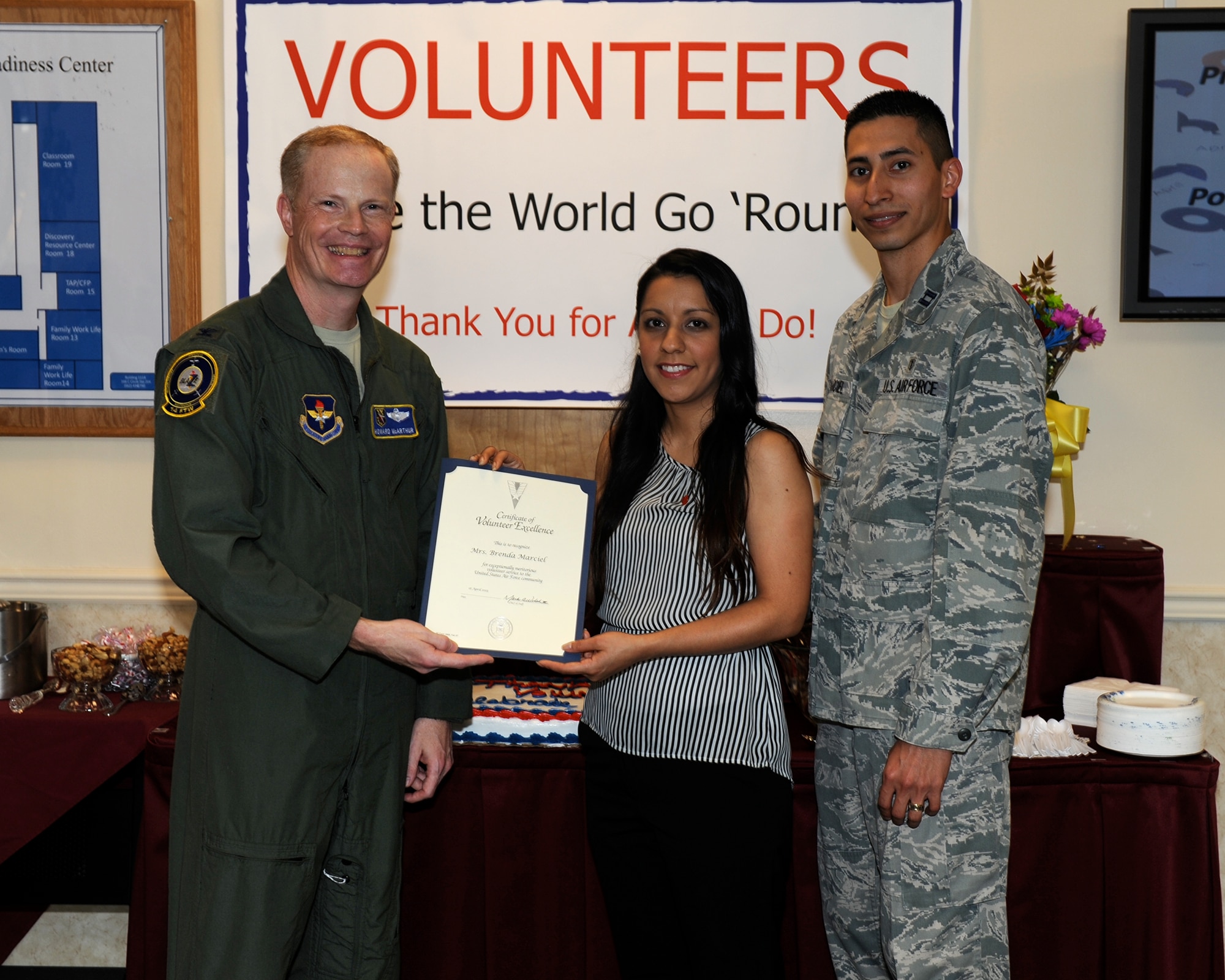 Col. Howard MacArthur, 14th Flying Training Wing Vice Commander, presents the Volunteer Excellence Award to Brenda Marciel, spouse of Capt. Daniel Marciel, 14th Medical Operations Squadron Mental Health Element Chief, April 16 on Columbus Air Force Base, Mississippi. The VEA was established to recognize federal civilians, family members, military retirees and federal retirees who perform outstanding volunteer community service of a sustained, direct and consequential nature. Brenda provided selfless service to Columbus Air Force Base and the Columbus Community from August 2013 to the present, specifically for the 14th FTW Chapel and the 14th FTW International Spouse’s Group. (U.S. Air Force photo/Elizabeth Owens)