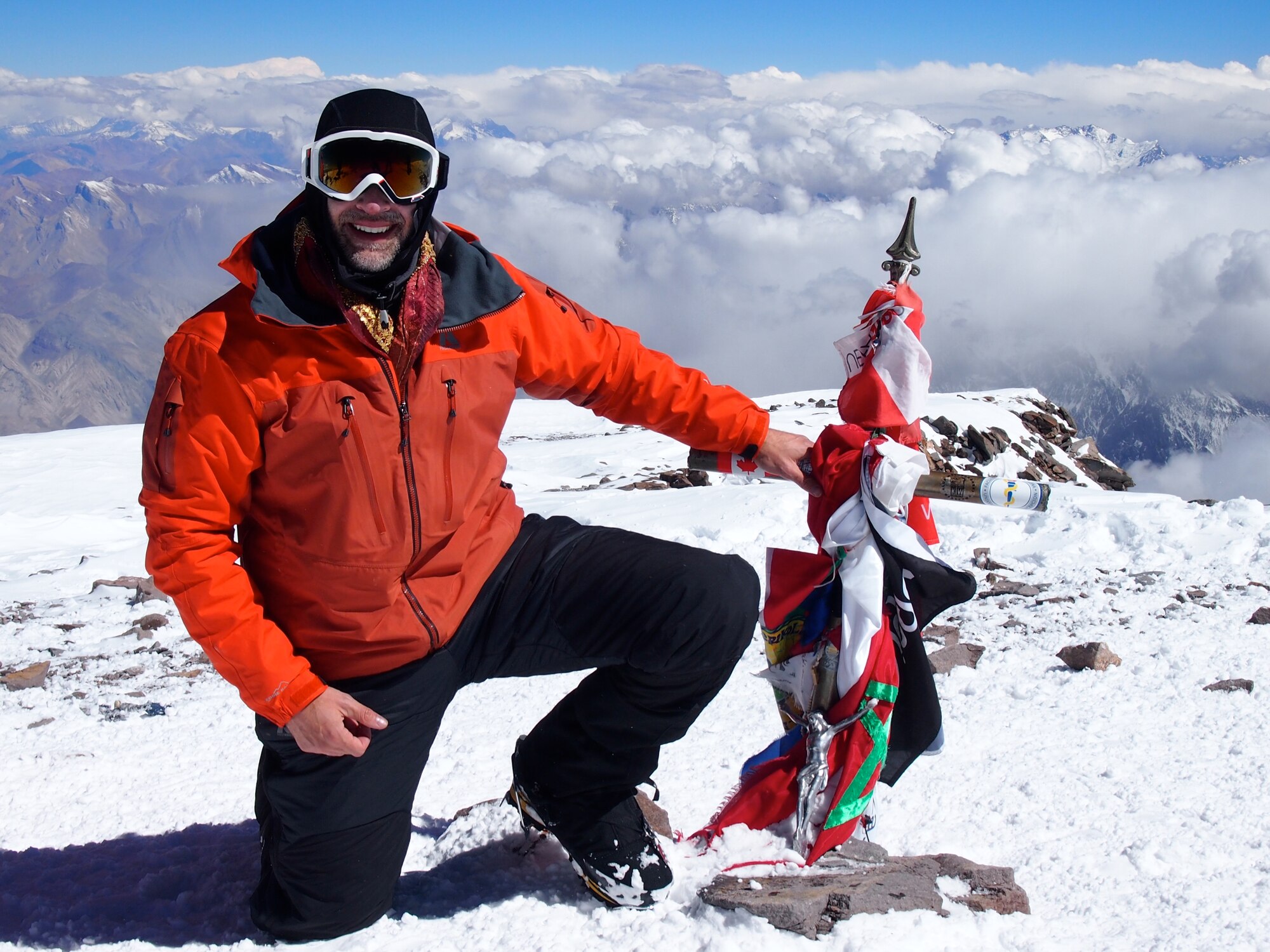 Lt. Col. Daniel Loveless, the 71st Medical Operations Squadron commander, kneels atop Aconcagua, Argentina, the highest point in the Southern and Western Hemispheres at 22,841 feet, in February. Loveless was one of 10 people in his group to crest the summit. His trek lasted from Feb. 7 to 21. (Courtesy photo)