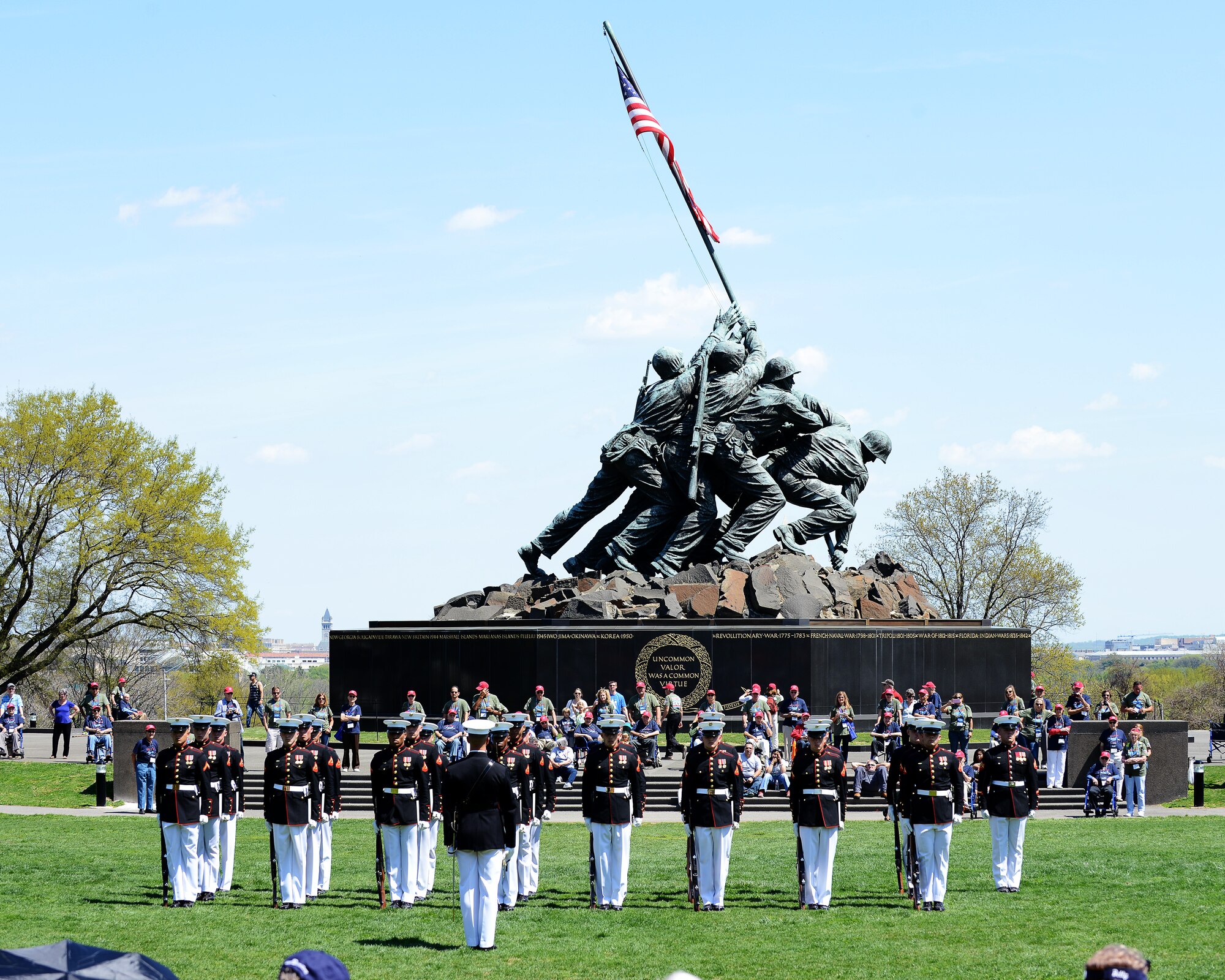 The U.S. Marine Corps Silent Drill Platoon performs for World War II and Korean War veterans at the Marine Corps War Memorial, Washington, D.C., April 18, 2015. The Honor Flight Historic Triangle Virginia members surprised the veterans with the Marines’ performance during the trip. (U.S. Air Force photo by Airman 1st Class Devin S. Michaels/Released)