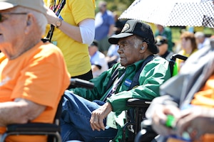 Joel Miller, U.S. Army Air Force, Air Corps Tuskegee Airman and World War II veteran, watches the U.S. Marine Corps Silent Drill Platoon perform at the Marine Corps War Memorial in Washington, D.C., April 18, 2015. Miller was assigned to the 332nd Fighter Group “Red Tails,” and served from Nov. 17, 1942 to Dec. 7, 1944. (U.S. Air Force photo by Airman 1st Class Devin S. Michaels/Released)