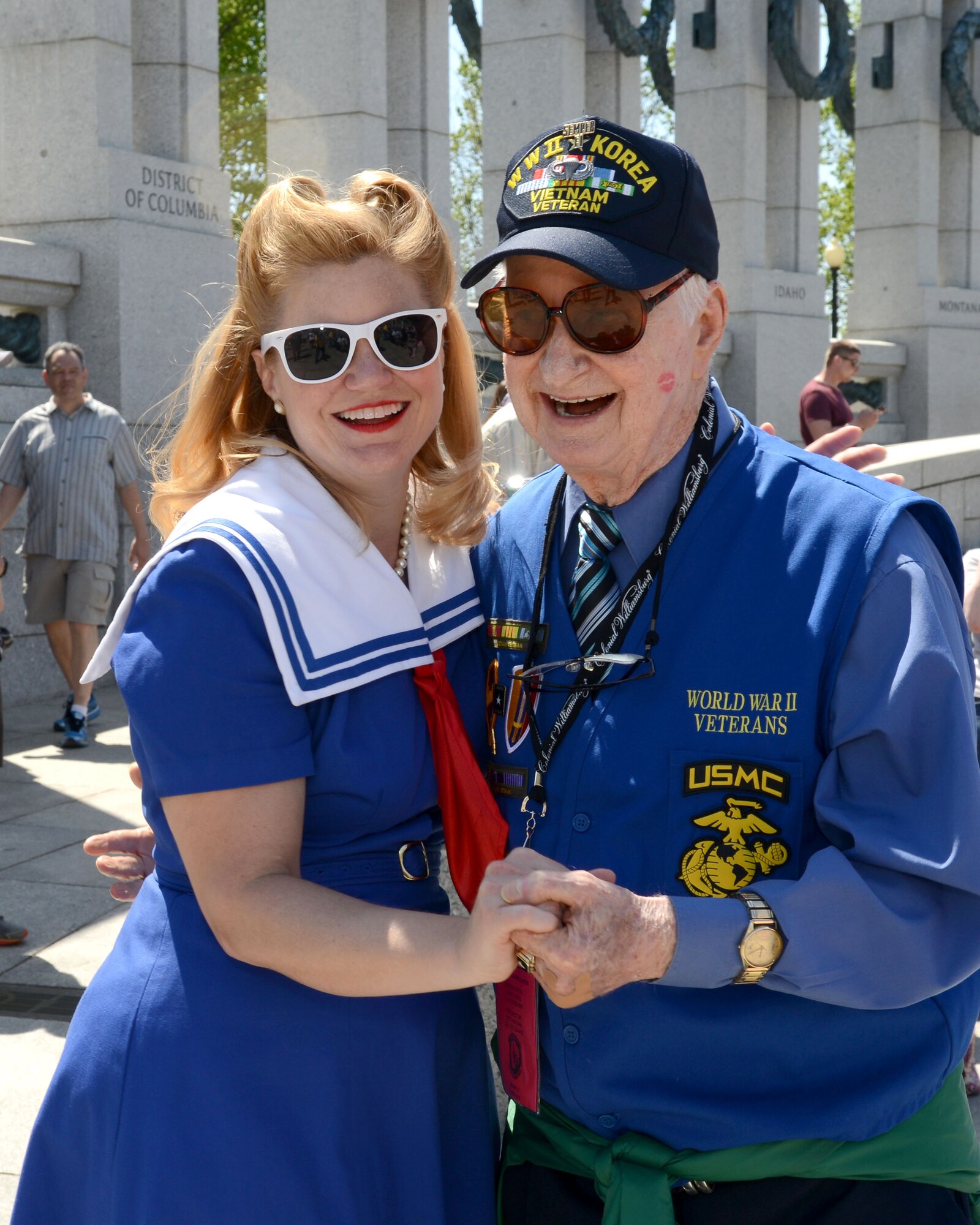U.S. Marine Corps World War II veteran Tommy Thomason dances with Theresa Werner, World War II Living History Swing Dancer, at the National World War II Memorial during an Honor Flight trip in Washington D.C., April 18, 2015. The dancers performed for the public and danced with the veterans. (U.S. Air Force photo by Airman 1st Class Devin S. Michaels/Released)