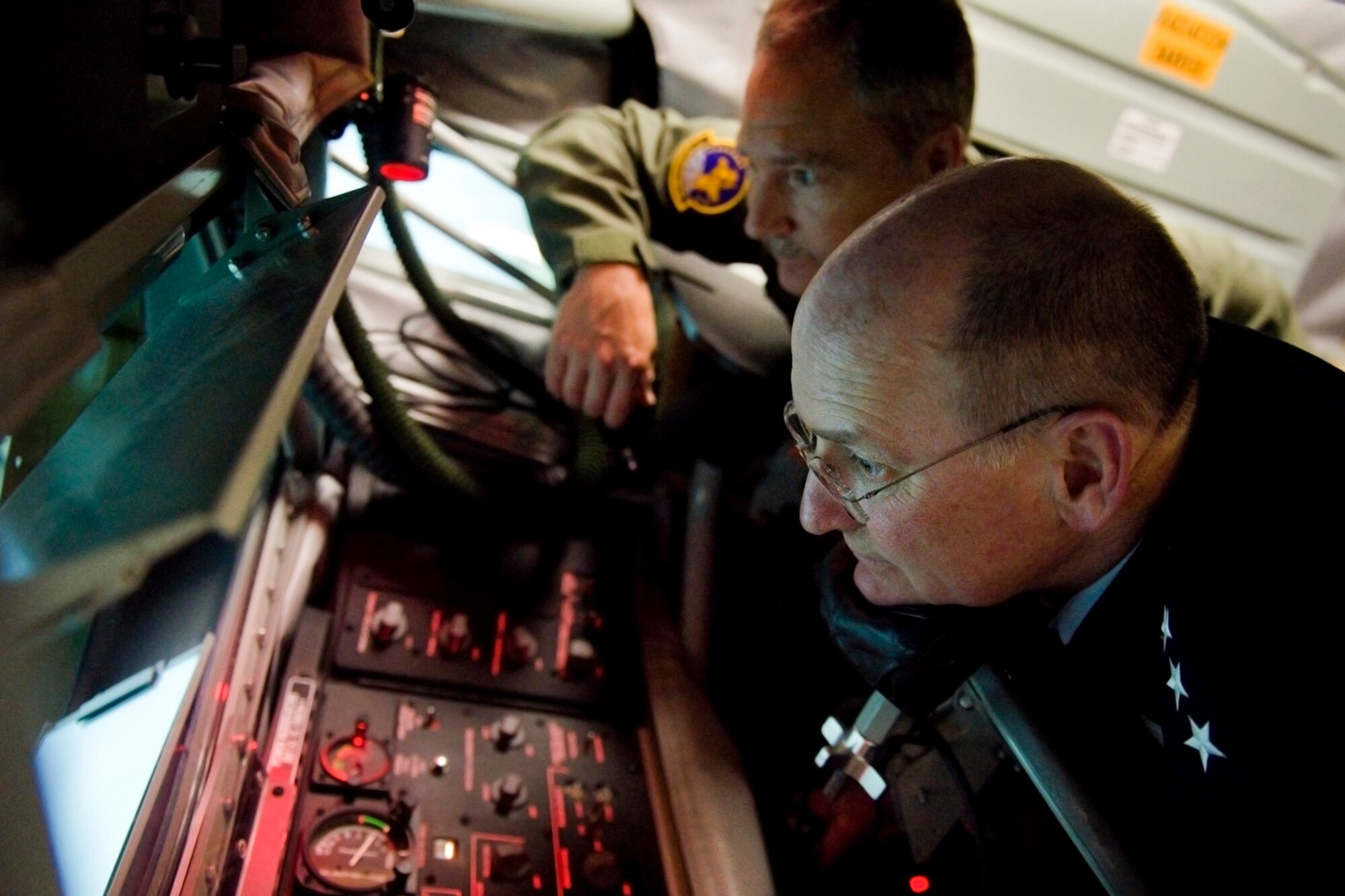 Lt. Gen. James Jackson, Chief of Air Force Reserve and Air Force Reserve Command commander, refuels a simulated F-16 Fighting Falcon aircraft as Master Sgt. Kenneth Knight, 72nd Air Refueling Squadron in-flight refueling technician, assists him in a boom operator weapons system trainer at Grissom Air Reserve Base, Ind., April 17, 2015. Grissom is the first AFRC base to have a BOWST, which will allows KC-135 Stratotanker boom operators to conduct vital training in a virtual environment. (U.S. Air Force photo/Tech. Sgt. Benjamin Mota)