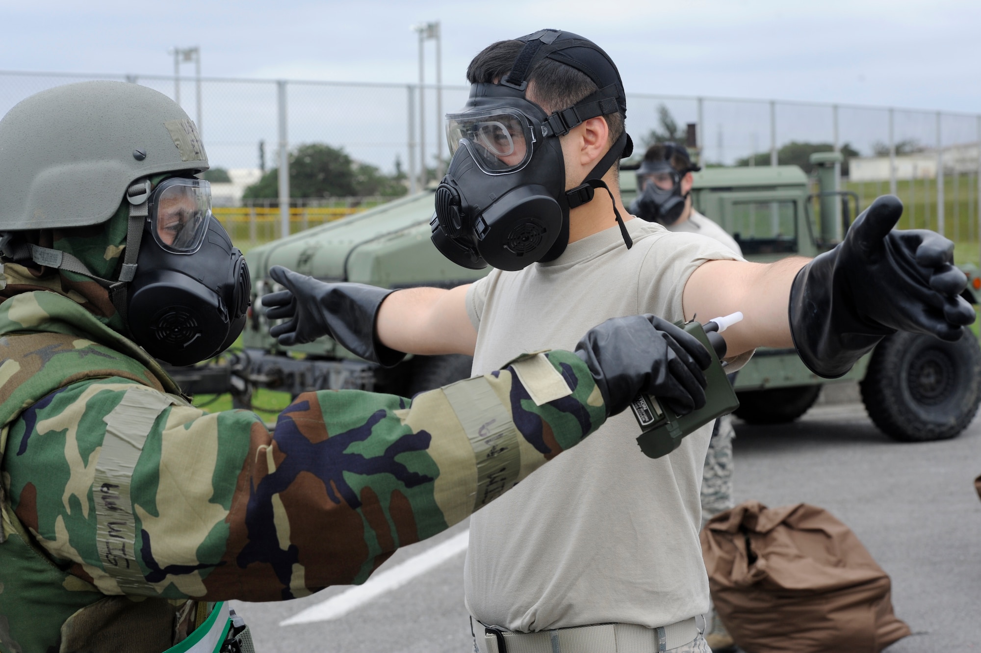 U.S. Air Force Airman 1st Class Ethan Fox, 18th Aircraft Maintenance Squadron, Chemical, Biological, Radiological, Nuclear and Explosives team member, uses contamination monitoring equipment on an Airman from the 18th Mission Support Group during Exercise Beverly High 15-2 on Kadena Air Base, Japan, April 22, 2015. The CBRNE team allowed the Airmen to quickly remove their simulated contaminated gear and get new gear to continue the mission. (U.S. Air Force photo by Staff Sgt. Marcus Morris)
