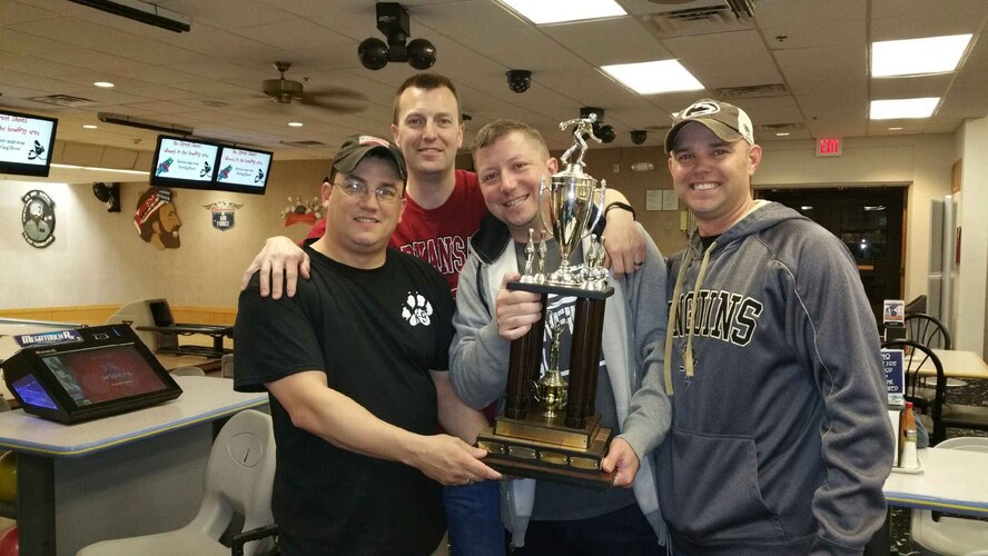 (Left to right) Shawn Brundzo, Brad Hancock, Rick Myers and Heath Conley, from the 71st Security Force Squadron bowling team, hoist the 1st Place trophy for the 2014 intramural bowling season March 19 at the Eagles Nest Bowling Alley, Vance Air Force Base, Okla. (U.S. Air Force courtesy photo)