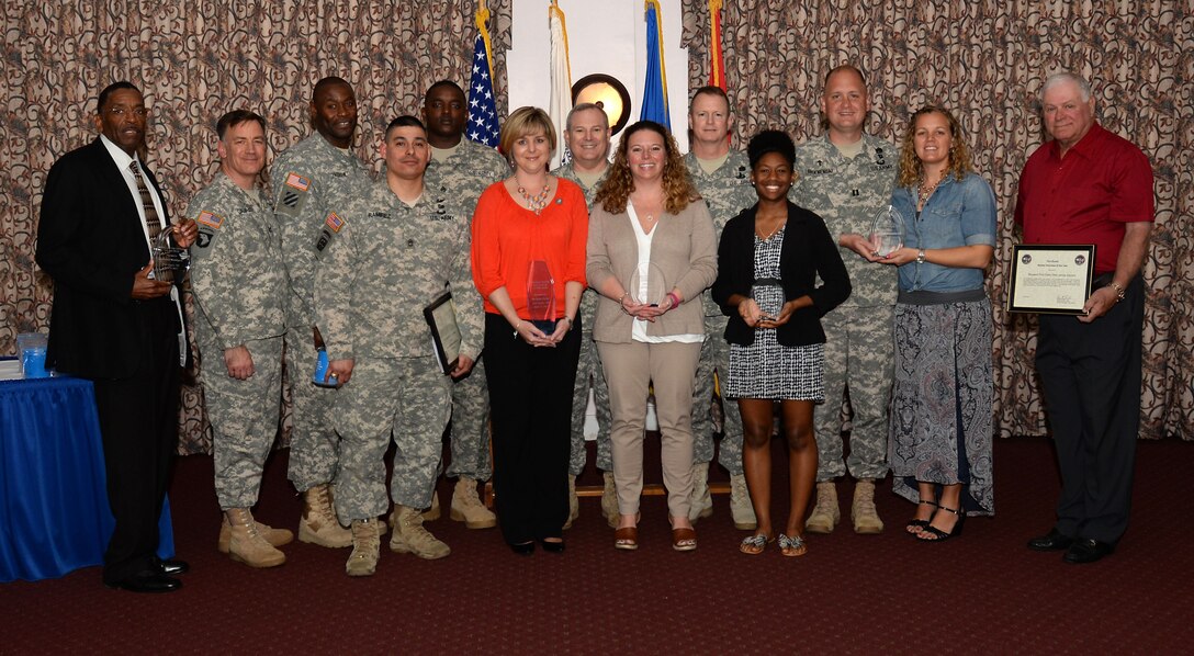 Volunteer of the Year winners pose with Fort Eustis leaders during a ceremony at Fort Eustis, Va., April 15, 2015. Volunteers were recognized from more than 30 organizations on the installation and in the local community. (U.S. Air Force photo by Staff Sgt. Teresa J. Cleveland/Released)