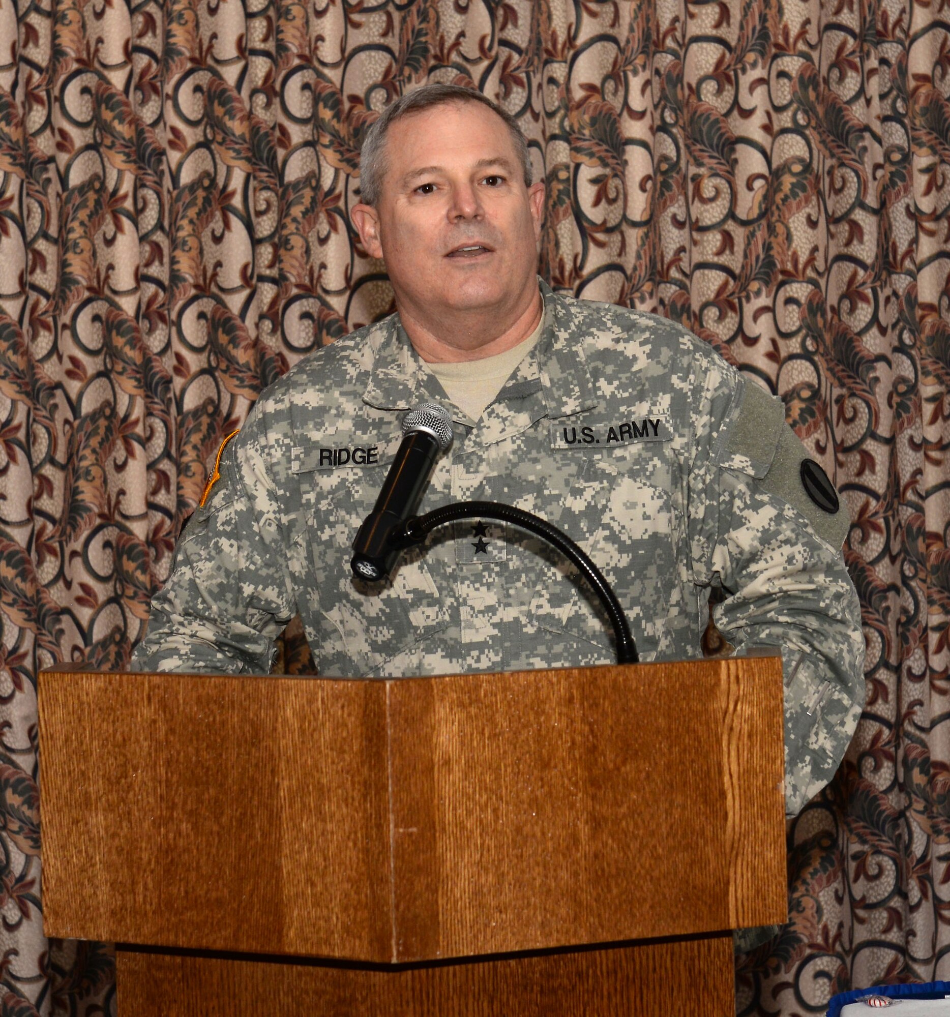 U.S. Army Maj. Gen. Ross Ridge, Initial Military Training deputy commanding general, speaks during the Volunteer Recognition Ceremony at Fort Eustis, Va., April 15, 2015. Ridge thanked volunteers for their continued support to the installation and the local community. (U.S. Air Force photo by Staff Sgt. Teresa J. Cleveland/Released)