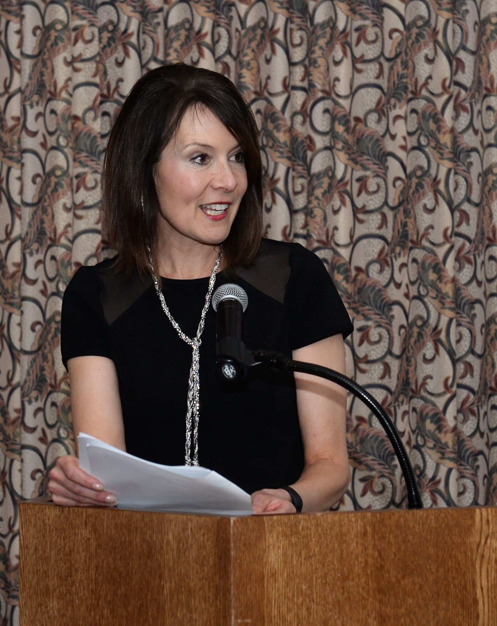 Ginger Perkins, wife of U.S. Army Gen. David Perkins, U.S. Army Training and Doctrine Command commander, speaks during the Volunteer Recognition Ceremony at Fort Eustis, Va., April 15, 2015. Perkins spoke about the importance of volunteerism and the good it does for the installation community. (U.S. Air Force photo by Staff Sgt. Teresa J. Cleveland/Released)