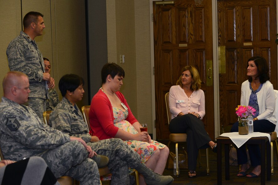 Betty Welsh, wife of Air Force Chief of Staff Gen. Mark A. Welsh III, speaks about the Key Spouse program with U.S. Air Force Maj. Joseph Stangl, 23d Aircraft Maintenance Squadron commander, during a Key Spouse meeting April 17, 2015, at Moody Air Force Base, Ga. Commanders, first sergeants and key spouses of various units attended the meeting to speak with Welsh about how to improve the program across the base. (U.S. Air Force photo by Airman 1st Class Kathleen D. Bryant/Released)