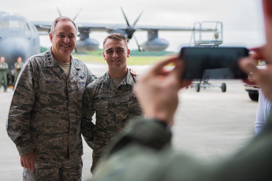 Air Force Chief of Staff Gen. Mark A. Welsh III, left, and Airman 1st Class Levi Harville Polk, 23d Logistics Readiness Squadron vehicle operator, take a photo April 17, 2015, at Moody Air Force Base, Ga. Welsh coined Harville Polk for his outstanding work and professionalism. (U.S. Air Force photo by Airman 1st Class Ceaira Tinsley/Released)