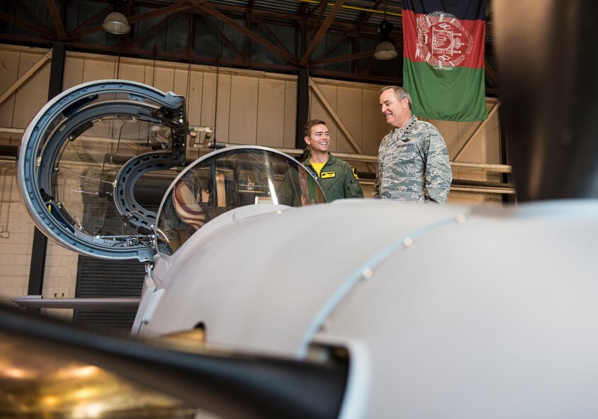 Air Force Chief of Staff Gen. Mark A. Welsh III, right, and an 81st Fighter Squadron pilot discuss the capabilities of the A-29 Super Tucano April 17, 2015, at Moody Air Force Base, Ga. Welsh familiarized himself with the aircraft and met with Airmen from the 81st FS and Afghan pilot students. (U.S. Air Force photo by Airman 1st Class Ceaira Tinsley/Released)