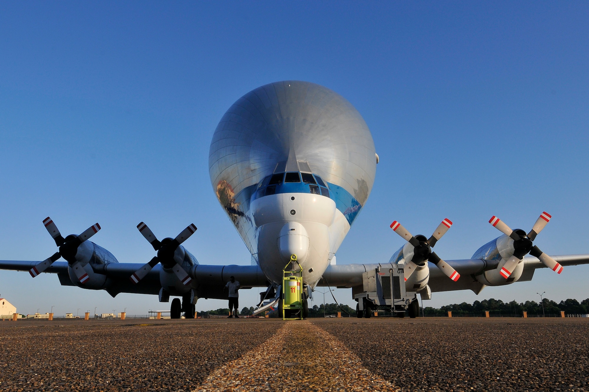 NASA's Aero Spacelines Super Guppy sits on the ramp at Maxwell Air Force Base, Alabama, on April 21, 2015, after diverting for weather as it headed to the Kennedy Space Center in Florida. The Super Guppy is a large, wide-bodied cargo aircraft that is used for hauling oversize cargo components. The aircraft measures more than 48 feet to the top of its tail and has a wingspan of more than 156 feet with a 25-foot diameter cargo bay. The aircraft features a hinged nose that opens 110 degrees. (Air Force Photo by Thomas Meneguin/Cleared)