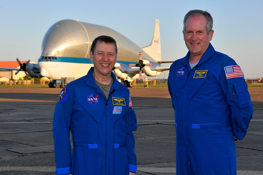 Greg Johnson, left, chief of aircraft operations and Ray Heineman, right, chief of safety, both from the Johnson Space Center, stand on the ramp at Maxwell AFB, Alabama, April 21, 2015, with NASA's Aero Spacelines Super Guppy behind them. The Super Guppy sits on the ramp after diverting for weather as it headed to the Kennedy Space Center in Florida.  (Air Force Photo by Thomas Meneguin/Cleared)