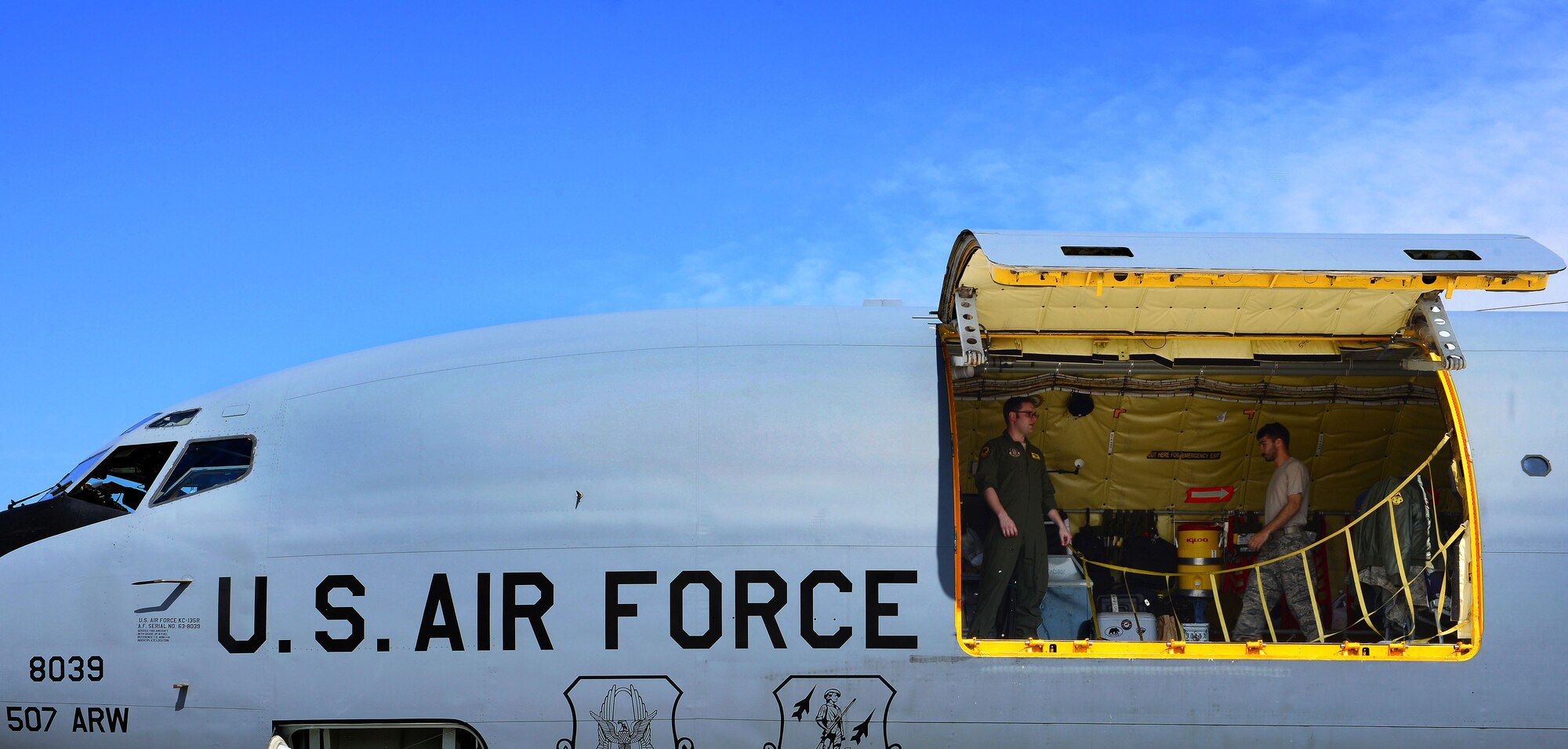 U.S. Air Force Airmen with the 507th Air Refueling Wing from Tinker Air Force Base, Okla., close a door on a KC-135 Stratotanker, April 21, 2015, at Aviano Air Base, Italy. More than 50 Air Force Reservists including chaplains, crew chiefs and force support worked with Aviano units during their two-week required annual tour. (U.S. Air Force photo by Senior Airman Matthew Lotz/Released)