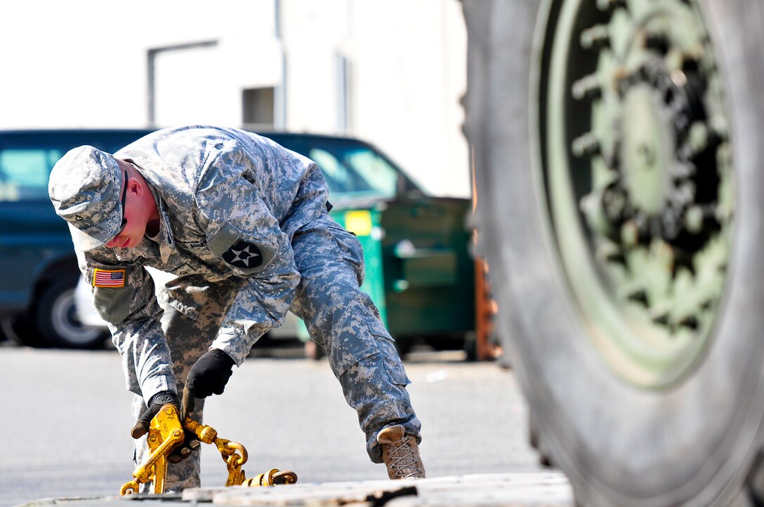 Army soldiers download Stryker vehicles for a static display in front of Safeco Field before the 14th Annual Seattle Mariners ‘Salute to Armed Forces Day’ game in Seattle, April 19, 2014. 
