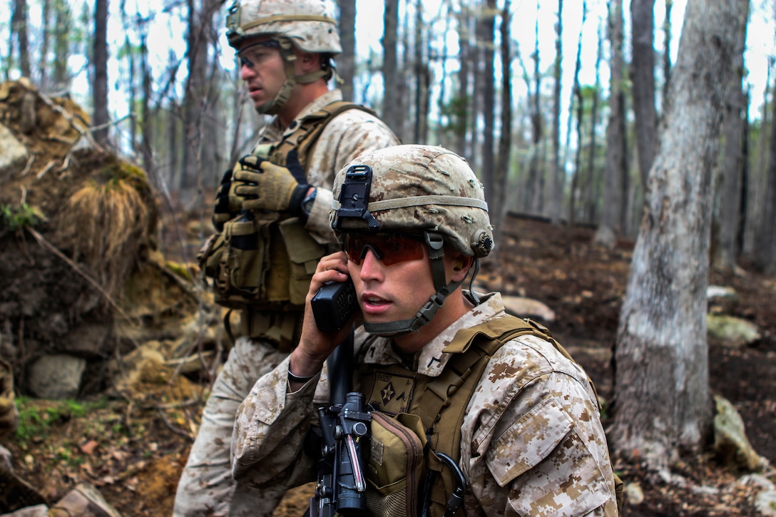 Marine Corps Pfc. Fletcher Klossing Radios Commands To The Machine Gun 