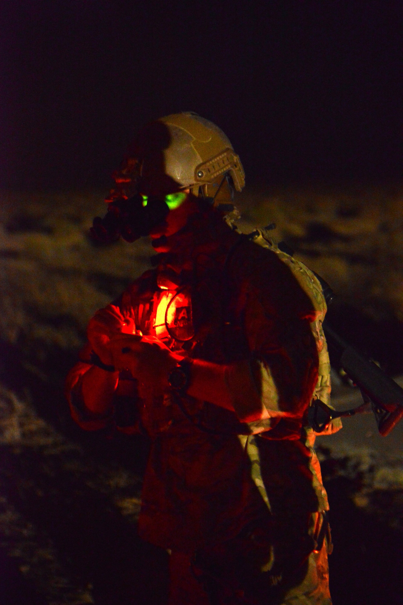 A pararescue jumper with the 52nd Expeditionary Rescue Squadron writes down patient information during a mass casualty response exercise April 19, 2015. The exercise tested the response of pararescue team members during a simulated plane crash with 12 victims. The 52nd ERQS is the primary personnel recovery unit supporting Operation INHERENT RESOLVE. (U.S. Air Force photo by Tech. Sgt. Jared Marquis/released)