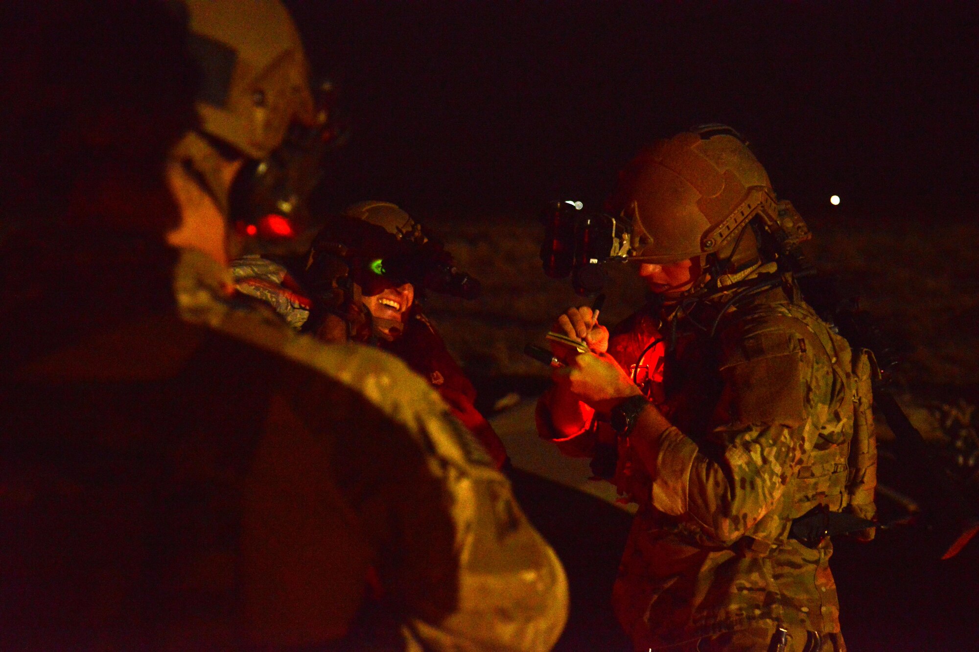 Pararescue Jumpers with the 52nd Expeditionary Rescue Sqadron evaluate a simulated patient during a mass casualty response exercise April 19, 2015. The exercise tested the response of pararescue team members during a simulated plane crash with 12 victims. The 52nd ERQS is the primary personnel recovery unit supporting Operation INHERENT RESOLVE. (U.S. Air Force photo by Tech. Sgt. Jared Marquis/released)
