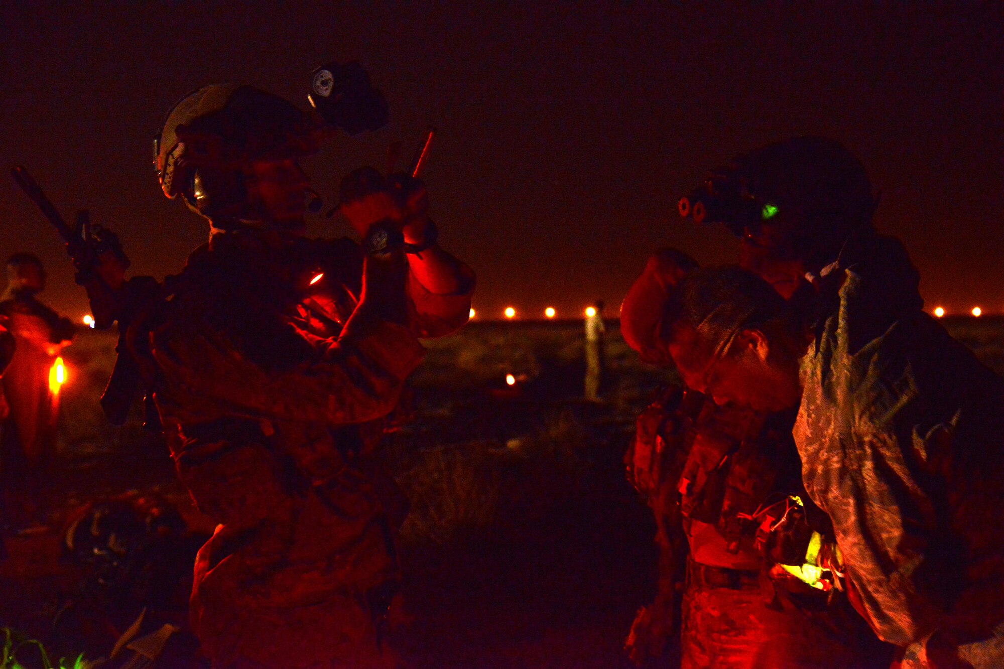 A pararescue jumper with the 52nd Expeditionary Rescue Squadron writes down patient information during a mass casualty response exercise April 19, 2015. The exercise tested the response of pararescue team members during a simulated plane crash with 12 victims. The 52nd ERQS is the primary personnel recovery unit supporting Operation INHERENT RESOLVE. (U.S. Air Force photo by Tech. Sgt. Jared Marquis/released)