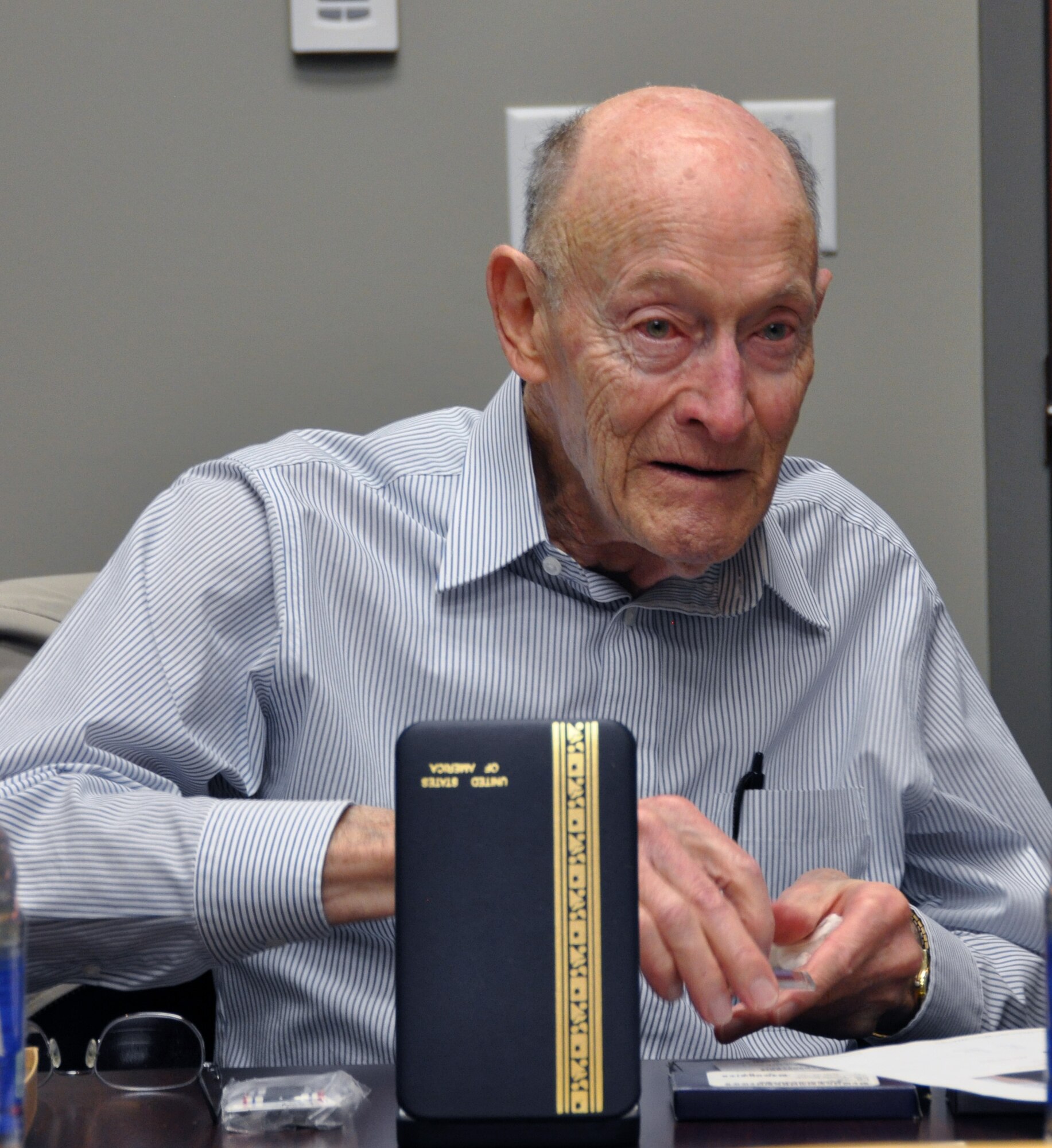 Former 1st Lt. Clayton A. Nattier, a veteran bomber pilot who was held as a prisoner of war during World War II, visited the Air Reserve Personnel Center to receive his POW Medal among various other medals, then took time to personally meet and thank the members on the recognition service team who assisted him April 17, 2015, on Buckley Air Force Base, Colo. Members from the ARPC recognition service team who assisted him are: retired Brig. Gen. Pat Quisenberry, evaluations branch chief, Jacqueline Bing, sustainment division chief, Master Sgt. Jeremy Bohn, pre-trained individual manpower division chief, and Master Sgt. Richard Grybos, NCO in charge of training and development. Nattier worked in conjunction with retired Lt. Col. Kathryn Wirkus, a constituent service representative from U.S. representative Ed Perlmutter’s staff, to attain his POW Medal. A formal presentation to award the POW Medal to Nattier is currently being planned by U.S. representative Ed Perlmutter’s office. (U.S. Air Force photo/Tech. Sgt. Rob Hazelett)