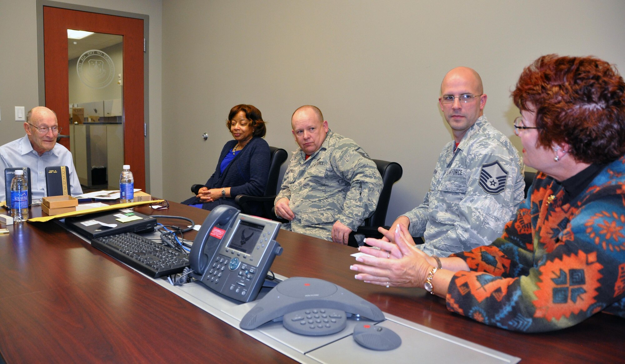 Former 1st Lt. Clayton A. Nattier, a veteran bomber pilot who was held as a prisoner of war during World War II, visited the Air Reserve Personnel Center to receive his POW Medal among various other medals, then took time to personally meet and thank the members on the recognition service team who assisted him April 17, 2015, on Buckley Air Force Base, Colo. Members from the ARPC recognition service team who assisted him are: retired Brig. Gen. Pat Quisenberry, evaluations branch chief, Jacqueline Bing, sustainment division chief, Master Sgt. Jeremy Bohn, pre-trained individual manpower division chief, and Master Sgt. Richard Grybos, NCO in charge of training and development. Nattier worked in conjunction with retired Lt. Col. Kathryn Wirkus, a constituent service representative from U.S. representative Ed Perlmutter’s staff, to attain his POW Medal. A formal presentation to award the POW Medal to Nattier is currently being planned by U.S. representative Ed Perlmutter’s office. (U.S. Air Force photo/Tech. Sgt. Rob Hazelett)