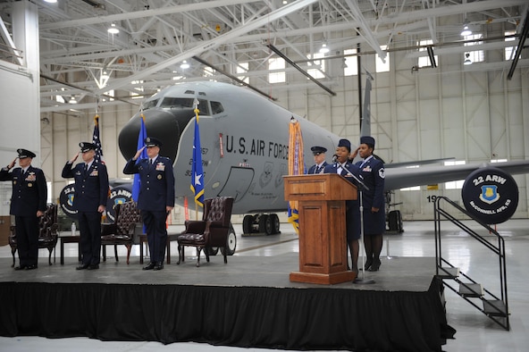 Airman 1st Class Bernice Yunwe Kwasinyui, a 22nd Logistics Readiness Squadron aircraft parts store technician, sings the national anthem during a change of command ceremony Feb. 12, 2015, at McConnell Air Force Base, Kan. Yunwe Kwasinyui, a Cameroon native, won a visa to come to the U.S. and joined the Air Force to give back to a country that has impacted her life. (U.S. Air Force photo/Airman 1st Class Tara Fadenrecht)
