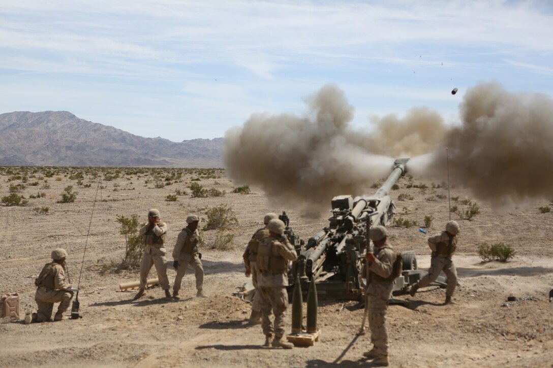 Marines with Battery A, 1st Battalion, 11th Marine Regiment, 1st Marine Division provide direct fire support during Exercise Desert Scimitar 2015 aboard Marine Corps Air Ground Combat Center Twentynine Palms, Calif., April 20, 2015. The tough, realistic live-fire training central to Desert Scimitar allows Division units to train in order to maintain readiness and meet current and real-world operational demands.