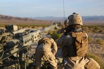 Corporal Osmar S. Gorish, a gun section chief with Battery A, 1st Battalion, 11th Marine Regiment, 1st Marine Division, prepares the next series of live-fire missions during Exercise Desert Scimitar 2015 aboard Marine Corps Air Ground Combat Center Twentynine Palms, Calif., April 20, 2015. The tough, realistic live-fire training central to Desert Scimitar allows Division units to train in order to maintain readiness and meet current and real-world operational demands.