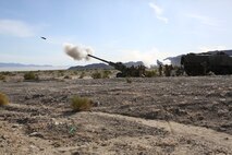 Marines with Battery A, 1st Battalion, 11th Marine Regiment, 1st Marine Division provide direct fire support during Exercise Desert Scimitar 2015 aboard Marine Corps Air Ground Combat Center Twentynine Palms, Calif., April 20, 2015. The tough, realistic live-fire training central to Desert Scimitar allows Division units to train in order to maintain readiness and meet current and real-world operational demands.