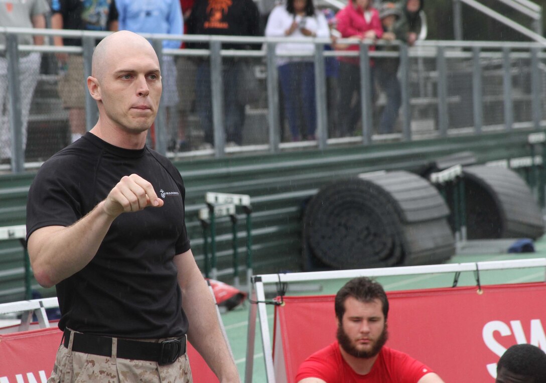 U.S. Marine Corps Capt. Christopher Ellison, an officer selection officer with Recruiting Station Raleigh and native of Atlanta, Georgia, speaks to participants of the Raleigh Semper Fidelis Football Camp at Cardinal Gibbons High School in Raleigh, North Carolina, April 19, 2015. The one-day camp brought in close to 200 high school football players from North Carolina and Virginia to give them a chance to work with Marines and National Football League coaches. The Semper Fidelis Football Camps are taking place in 24 cities across the country to showcase the Marine Corps’ commitment to developing quality citizens and highlight how Marine Corps values of honor, courage and commitment relate to success both on and off the field.  (U.S. Marine Corps photo by Sgt. Dwight A. Henderson/Released)
