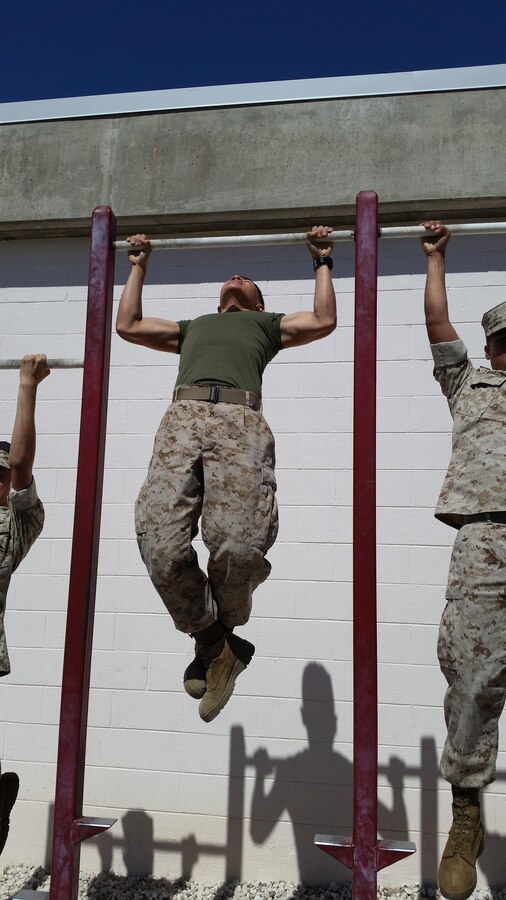 PFC Donald L. Nguyen knocking out a set of 20 Pull-ups with his fellow classmates from Telephone Systems Personal Computer Repair Course class 2015-040.