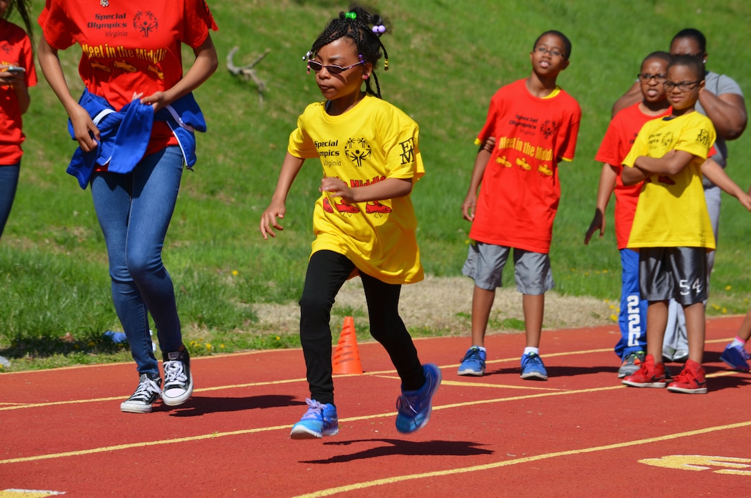 Jordyn, 7, takes off from the starting line of the 50-meter sprint during Special Olympics Virginia’s “Meet in the Middle” held at Butler Stadium Saturday. Sixty athletes participated, thanks to 140 volunteers who helped the event run smoothly. 