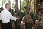 SCHOFIELD BARRACKS, Hawaii (Apr. 21, 2015) - Army Secretary John M. McHugh shakes hands with Staff Sgt. David Cornejo after receiving a Jungle Operations Training Course demonstration from the cadre on Schofield Barracks. Cornejo is assigned to the 25th Infantry Division's Lightning Academy. McHugh visited Oahu and the infantry division to receive a first-hand look at one of the linchpins of the Army's success in the Pacific region.  