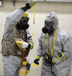 In this file photo, Staff Sgt. Lucas Michael Applewhite and Staff Sgt. Rolando Contreras check for a chemical agent during training at Rodriguez Live Fire Complex, South Korea, March 25, 2015. Applewhite, an explosive ordnance disposal team leader, and Contreras, a sample team leader, are assigned to the 501st Chemical, Biological, Radiological, Nuclear, Radiological Technical Escort Company, 23rd Chemical, Biological, Radiological, Nuclear and Explosive Ordnance Battalion, 1st Armored Brigade Combat Team, 2nd Infantry Division.