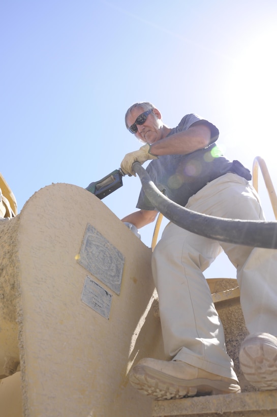 Greg Walker, from the Engineering Equipment Unit, refuels his water truck with biodiesel at the Yermo Annex.
