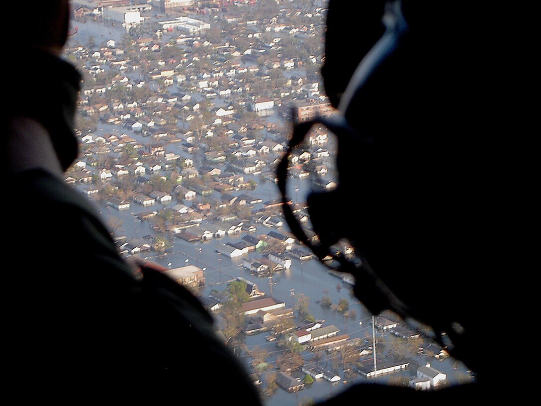 New Orleans, LA (Sep 5, 2005--AMT Jay Wright's helmet frames the New Orleans flooding from Hurricane Katrina.   USCG Photo by Gary Johnson, USCGAUX