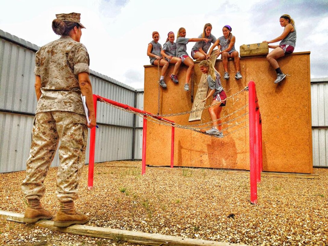 Major Anita Genetti, the NROTC Program Marine with Texas A&M College station, 
assisted the officer selection team in of OSO College Station during a Marine 
Corps Leadership Reaction Course with the female soccer team from Texas A&M, 
April 22, 2015.  The  Marines wanted to give the number one nationally ranked 
female college soccer team a first-hand lesson on team work and Marine Corps 
leadership.
