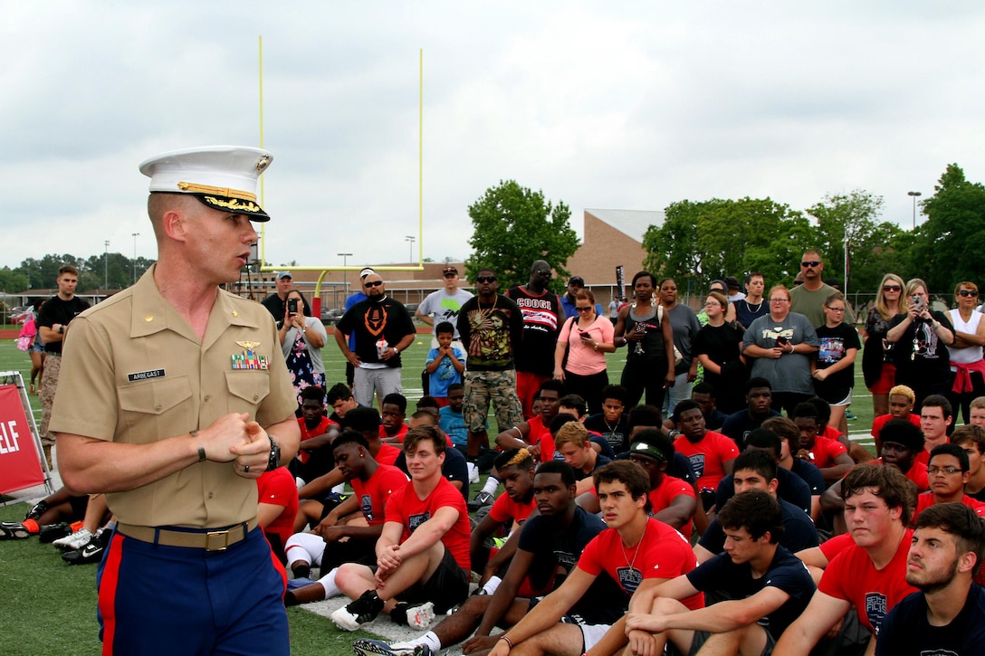 Major Robert  C. Arbegast,  the Commanding Officer of Recruiting Station Houston, speaks about leadership on and off the field to the young men participating in the Semper Fidelis All-American Football Camp at Westfield High School. Semper Fidelis All-American Camps are the first phase of the Semper Fidelis Football Program. From mid-March through the end of June, 2015, 1-day football camps will be in 24 cities across the country. Open to high schools students in 9th, 10th and 11th grade, Semper Fidelis All-American Camps not only hone football skills, but teach players about Marine Corps values both on and off the field. (U.S. Marine Corps photo by Sgt. Gabrielle Bustos)