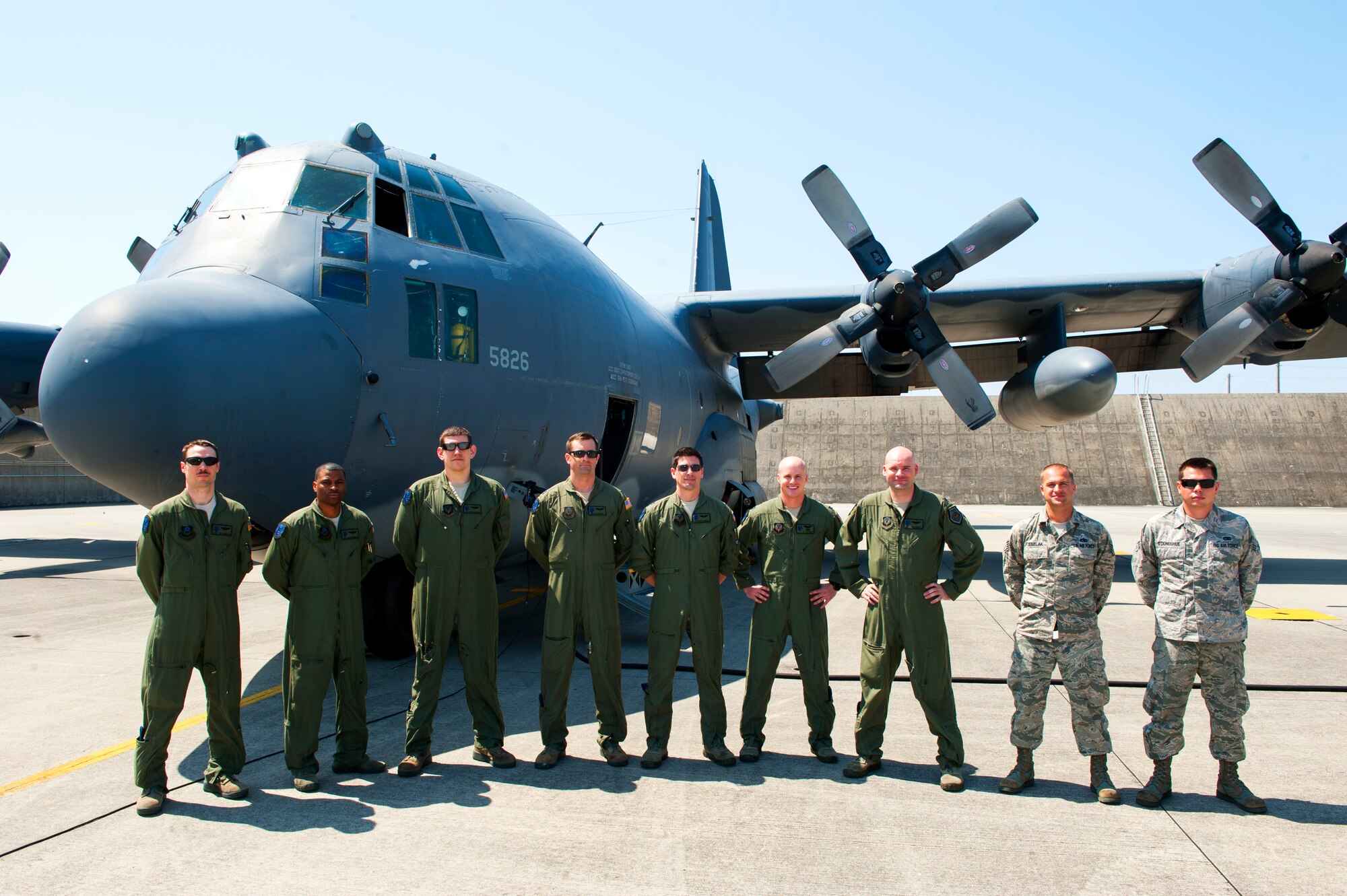 The MC-130P Combat Shadow team responsible for getting plane 5826 to its final resting place at Davis-Monthan Air Force Base, Ariz. poses for a group photo on Kadena Air Base, Japan, April 15, 2015. The Pacific-based Combat Shadows alone have supported more than a dozen named operations. From combat missions in Operations Enduring Freedom and Iraqi Freedom to humanitarian assistance and disaster relief operations across Asia, the Combat Shadow left its mark in special operations history. (U.S. Air Force photo by Airman 1st Class Stephen G. Eigel) 