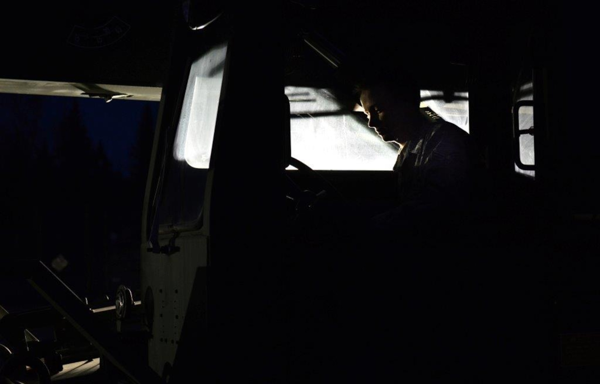 The first load of the ammunition containers arrive on Joint Base Elmendorf-Richardson April 15. Contracted forklift operators use their skills to unload each container weighing between 20,000 and 40,000 pounds. After they are offloaded from the trucks, the ammunition inspection team standing by opens the containers and inspects the ammunition before storing them into earth-covered igloos. (U.S. Air Force Photo/Airman 1st Class Kyle Johnson)