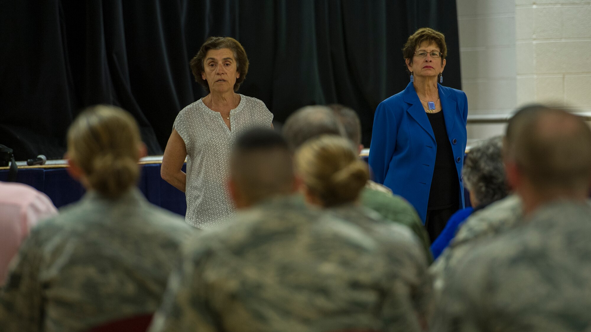 Theresa Dulgov, Holocaust survivor and Dr. Gail Wallen, founder and director of the military holocaust education program answer questions from military members and students during the Holocaust day of remembrance at Holloman Air Force Base, N.M., April 21, 2015. Wallen gave a detailed explanation of the events that took place during the Holocaust, her two guests then told their personal experiences of living through the tragedy as well. (U.S. Air Force photo by Airman 1st Class Aaron Montoya / Released)
