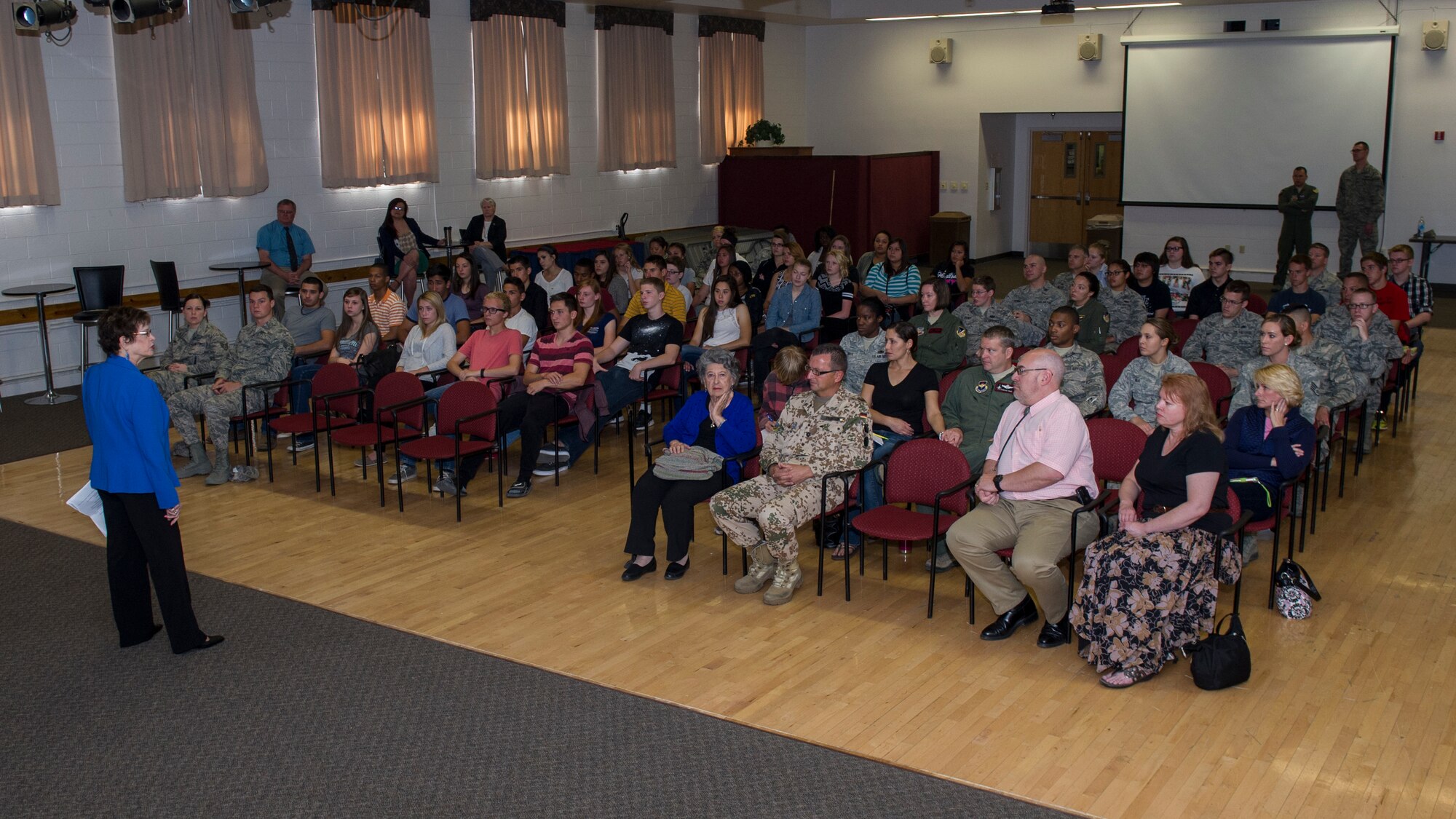 Dr. Gail Wallen, founder and director of the military Holocaust educational program, delivers an informational speech about the Holocaust at Holloman Air Force Base, N.M., April 21, 2015. Wallen and her guests, Theresa Dulgov and Lily Brull, both Holocaust survivors, spent the day providing information and telling personal experiences about the Holocaust to military members and advanced placement students from Alamogordo High School. (U.S. Air Force photo by Airman 1st Class Aaron Montoya / Released)