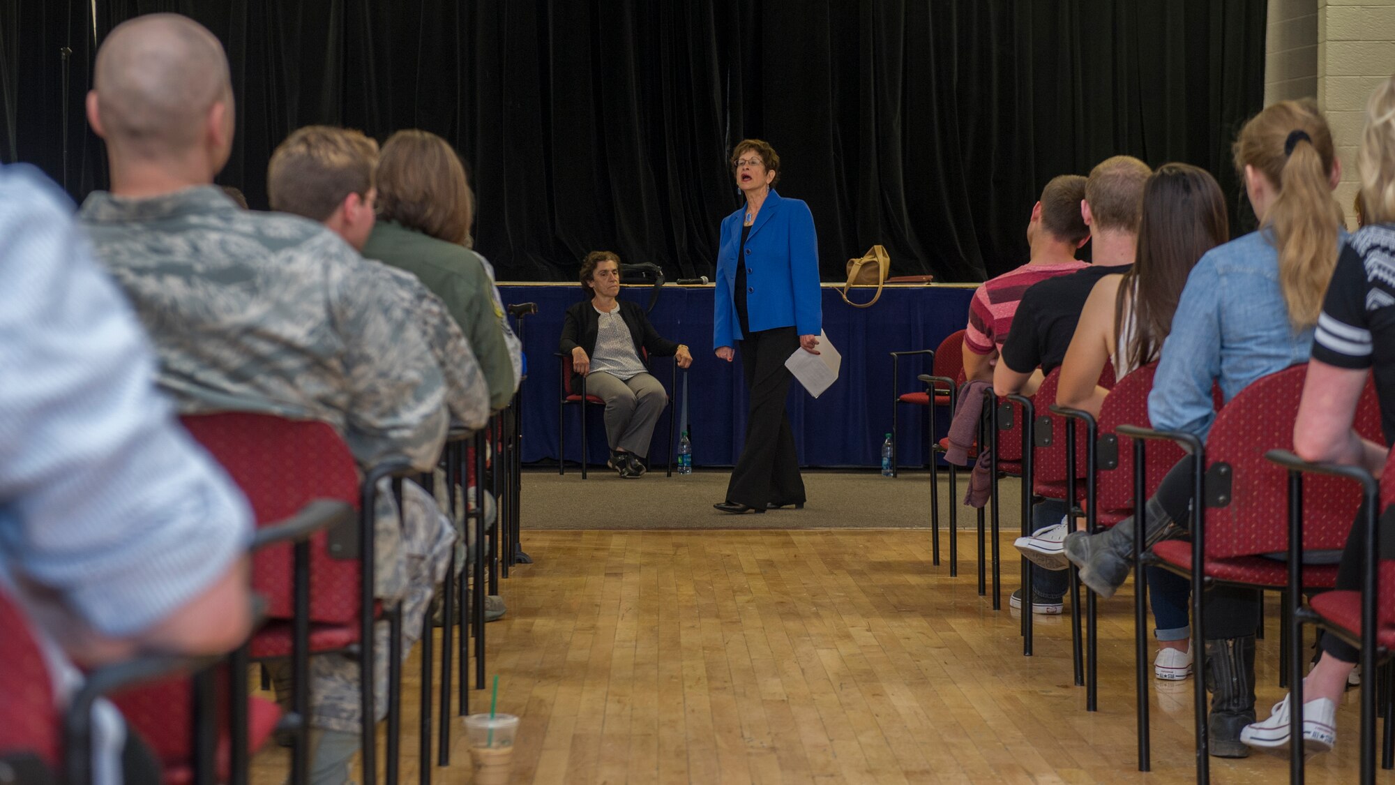 Dr. Gail Wallen, founder and director of the military Holocaust educational program, introduces herself and her guests during the Holocaust day of remembrance at Holloman Air Force Base, N.M., April 21, 2015. Wallen established the Holocaust military education program in 2002 due to the mandate that all U.S. military bases and ships at sea will host a Holocaust day of remembrance, to ensure future generations remember the sacrifices made during World War II. (U.S. Air Force photo by Airman 1st Class Aaron Montoya / Released)