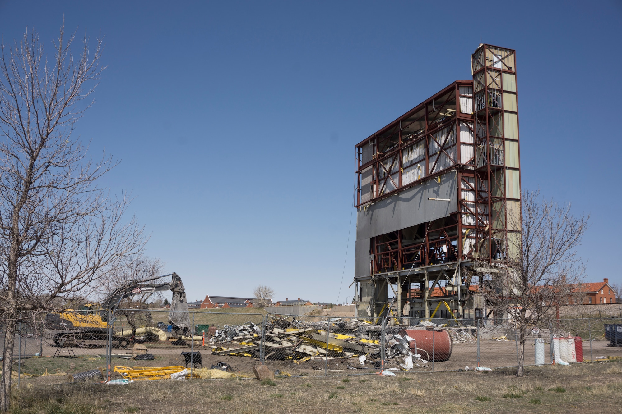 A deconstruction crew prepares the central heating plant for demolition April 22, 2015, on F.E. Warren Air Force Base, Wyo. The deconstruction is the final stage of the  decentralization of Warren's heating, which began in June 2013. (U.S. Air Force photo by Lan Kim)
