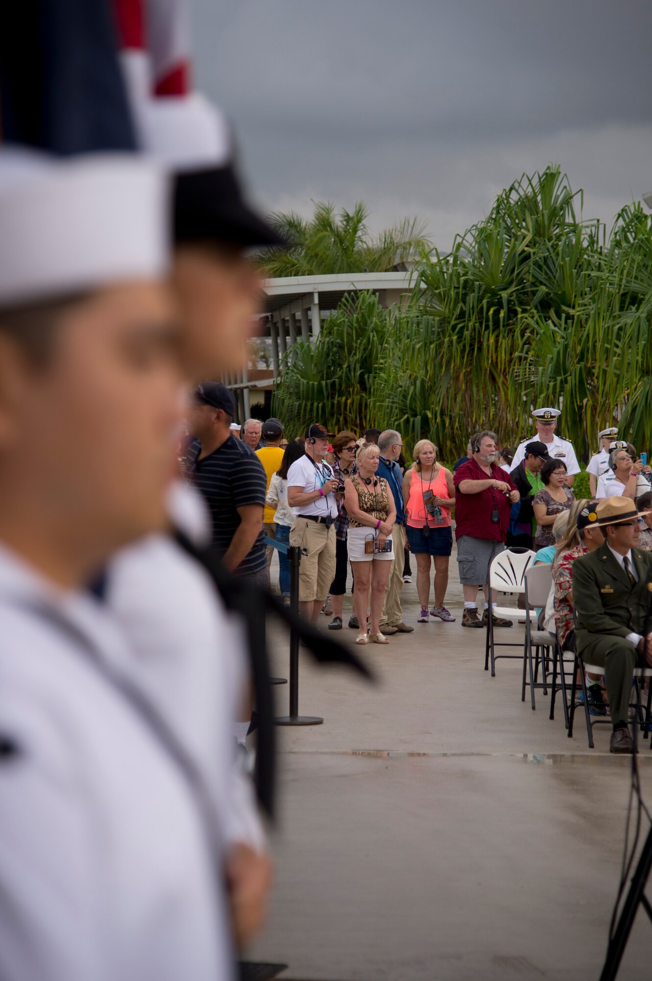 The Joint Base Honors and Ceremonies Guard await the order to present the colors during the Pearl Harbor Colors Ceremony at the Pearl Harbor Visitor Center, Hawaii, April 23 2015. The theme of this month’s honors ceremony is “Earth Day: A Sustainable Future Begins With You.” (U.S. Air Force photo by Tech. Sgt. Aaron Oelrich/Released)
