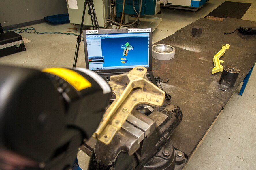 Tech. Sgt. Gregory Kirchner, 92nd Maintenance Squadron aircraft metals technology craftsman, scans a KC-135 Stratotanker part with the unit’s new 3-D laser imaging arm March 25, 2015, at Fairchild Air Force Base, Wash. The ROMER Absolute Arm is a portable measurement and 3-D scanning solution used to perform computer-aided design-to-part inspections and accurately capture 3-D features and freeform shapes for reverse engineering tasks. (U.S. Air Force photo/Staff Sgt. Benjamin W. Stratton)