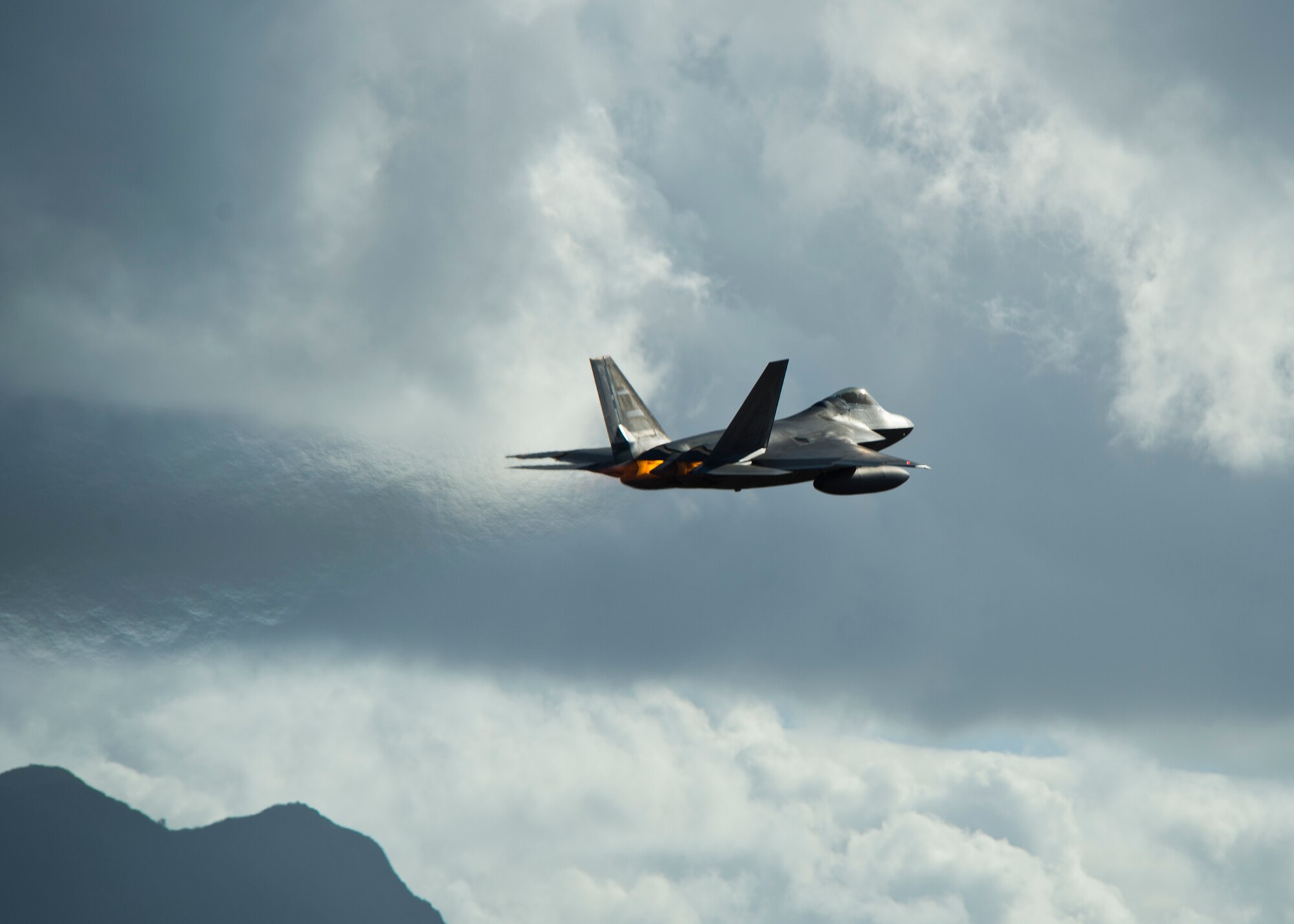 A United States Air Force F-22 Raptor, from the Hawaiian Raptors, takes off from Joint Base Pearl Harbor-Hickam, Hawaii, April 20, 2015. The F-22 engines produce more thrust than any current fighter engine. The combination of sleek aerodynamic design and increased thrust allows the F-22 to cruise at supersonic airspeeds (greater than 1.5 Mach) without using afterburner -- a characteristic known as supercruise. Supercruise greatly expands the F-22 's operating envelope in both speed and range over current fighters, which must use fuel-consuming afterburner to operate at supersonic speeds.  (U.S. Air Force photo by Tech. Sgt. Aaron Oelrich/Released)    