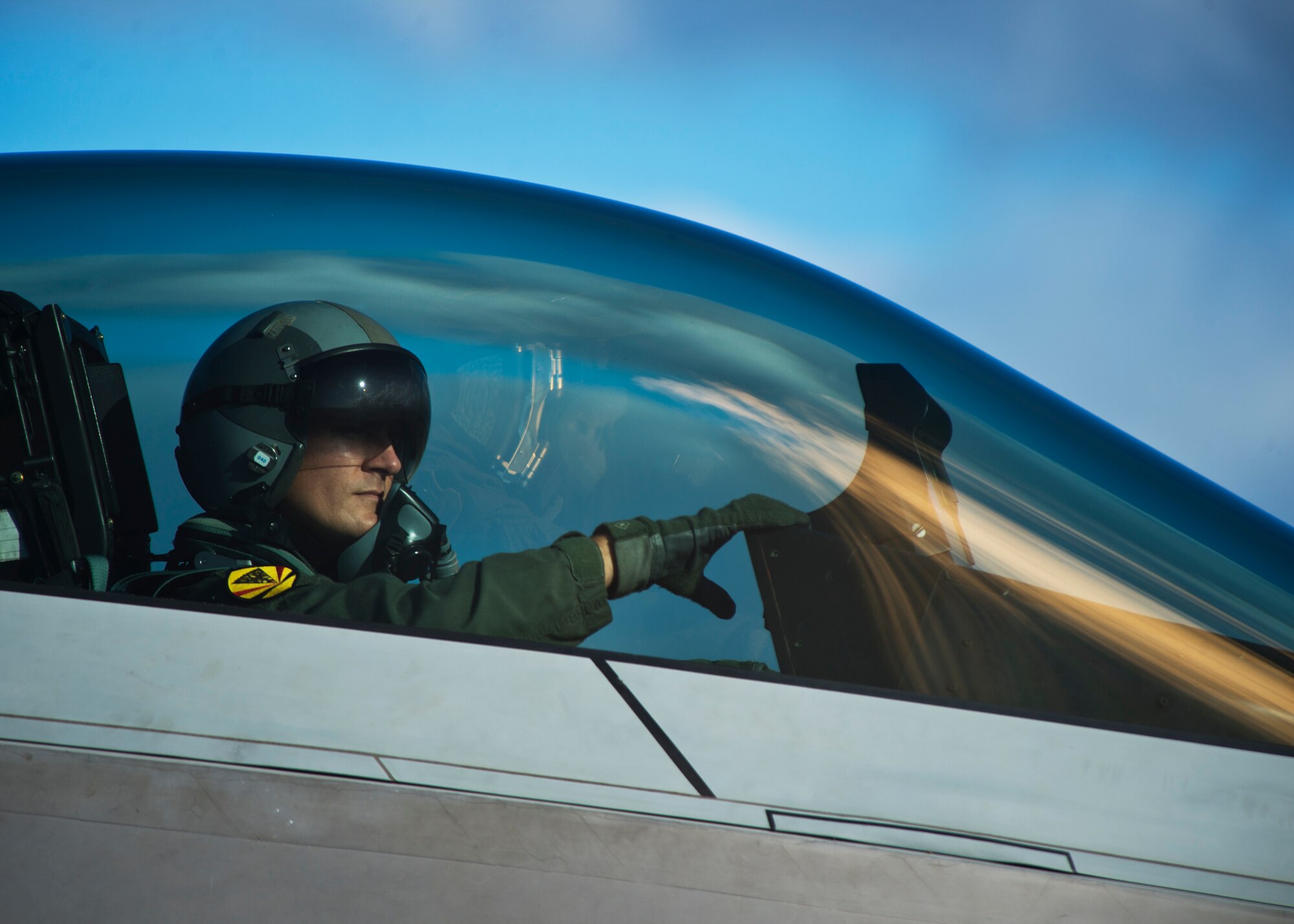A pilot from the Hawaiian Raptors, awaits the conclusion of an end of runway inspection of the F-22 Raptor on Joint Base Pearl Harbor-Hickam, Hawaii, April 20, 2015. The F-22 possesses a sophisticated sensor suite allowing the pilot to track, identify, shoot and kill air-to-air threats before being detected. Significant advances in cockpit design and sensor fusion improve the pilot's situational awareness. (U.S. Air Force photo by Tech. Sgt. Aaron Oelrich/Released)   