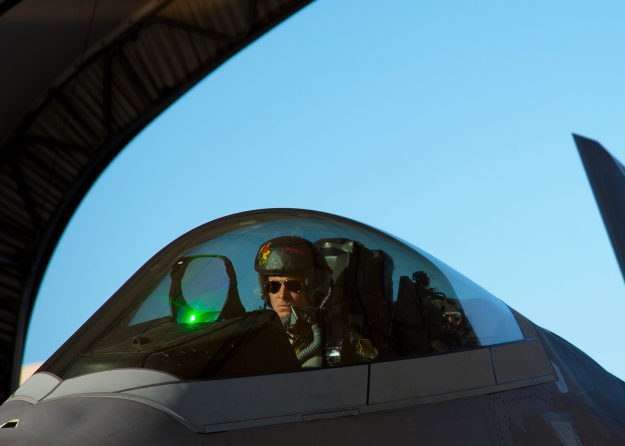 A pilot from the Hawaiian Raptors prepares the F-22 Raptor for engine start on Joint Base Pearl Harbor-Hickam, Hawaii, April 20, 2015. The F-22 Raptor’s combination of stealth, supercruise, maneuverability, and integrated avionics, coupled with improved supportability, represents an exponential leap in warfighting capabilities. The Raptor performs both air-to-air and air-to-ground missions allowing full realization of operational concepts vital to the 21st century Air Force. (U.S. Air Force photo by Tech. Sgt. Aaron Oelrich/Released)   
