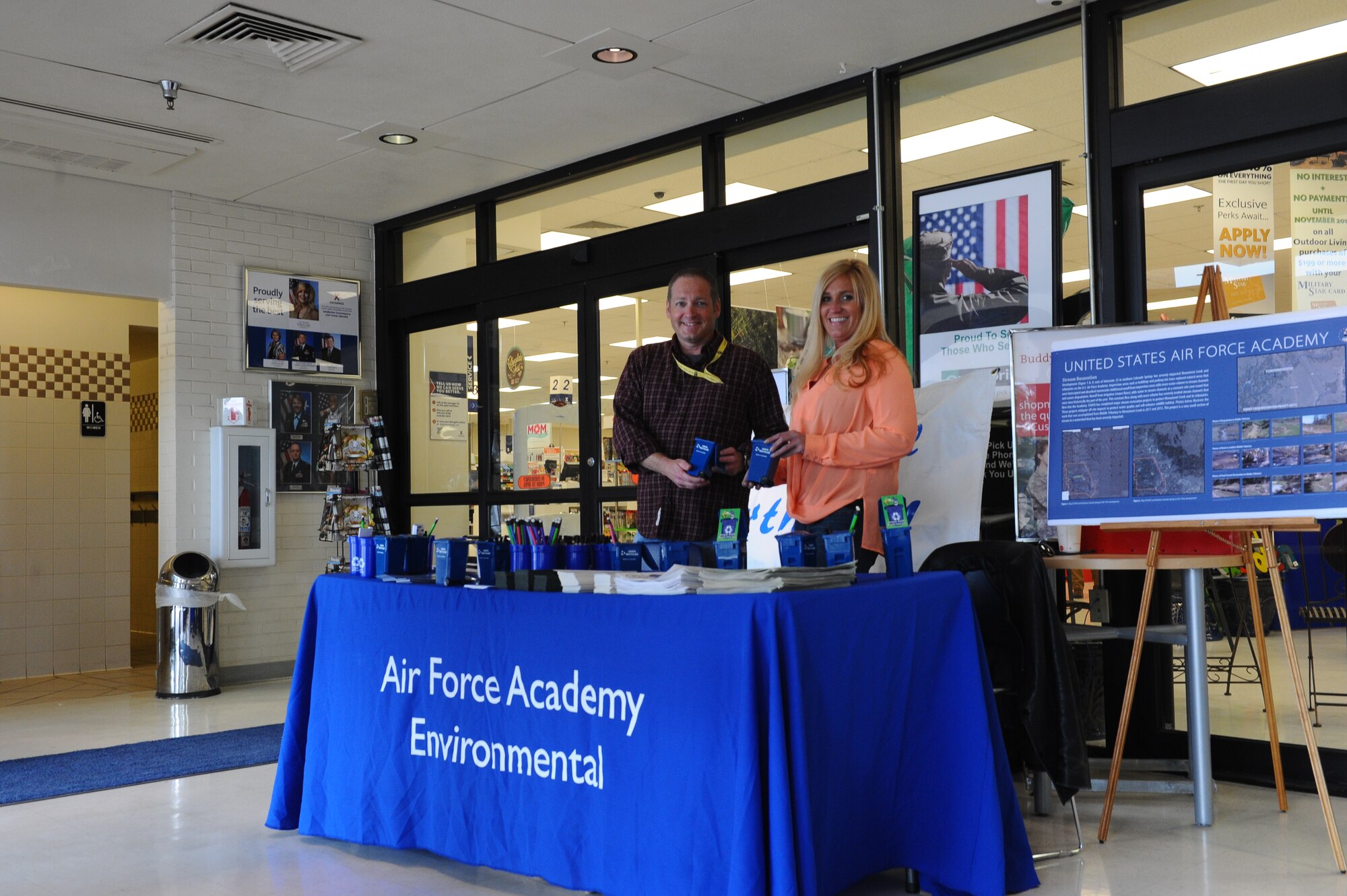 Brian Gott and Jeanie Duncan, both environmental technicians with the 10th
Civil Engineer Squadron at the U.S. Air Force Academy, man the booth for
Earth Day at the Base Exchange April 22, 2015. The Academy recycles over
seven million pounds of material every year from official Academy
operations. (U.S. Air Force photo/Airman 1st Class Rachel Hammes)