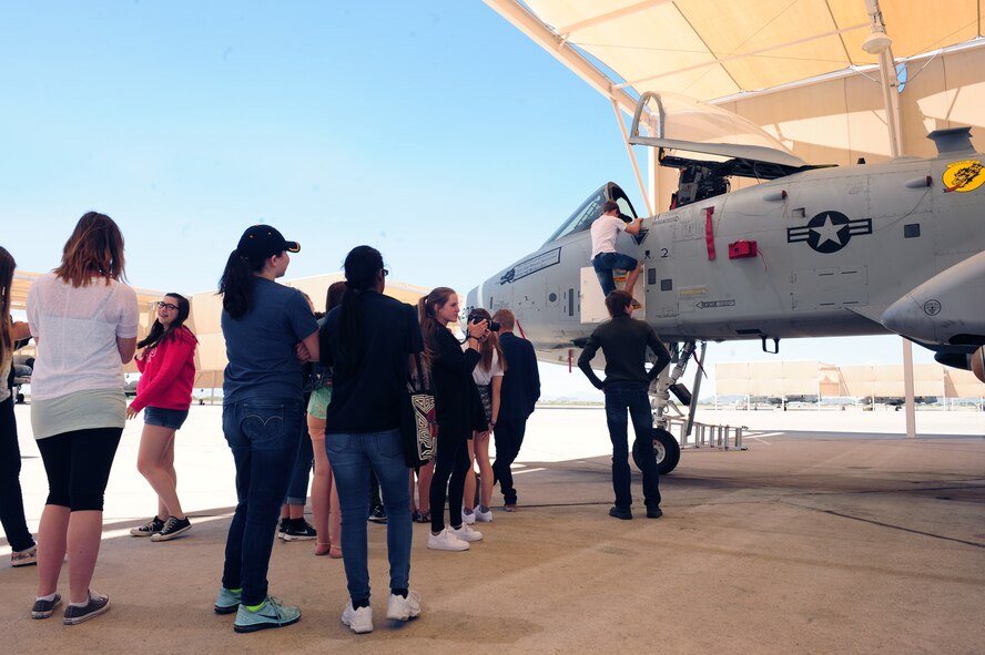 Students from Buena Vista High school as well as cultural exchange students from Dresden Germany wait in line to climb into an A-10C Thunderbolt II at Davis-Monthan Air Force Base Ariz., April 23, 2015. The students were all given the chance to sit inside an A-10. (U.S. Air Force photo by Airman 1st Class Cheyenne Morigeau/Released)

